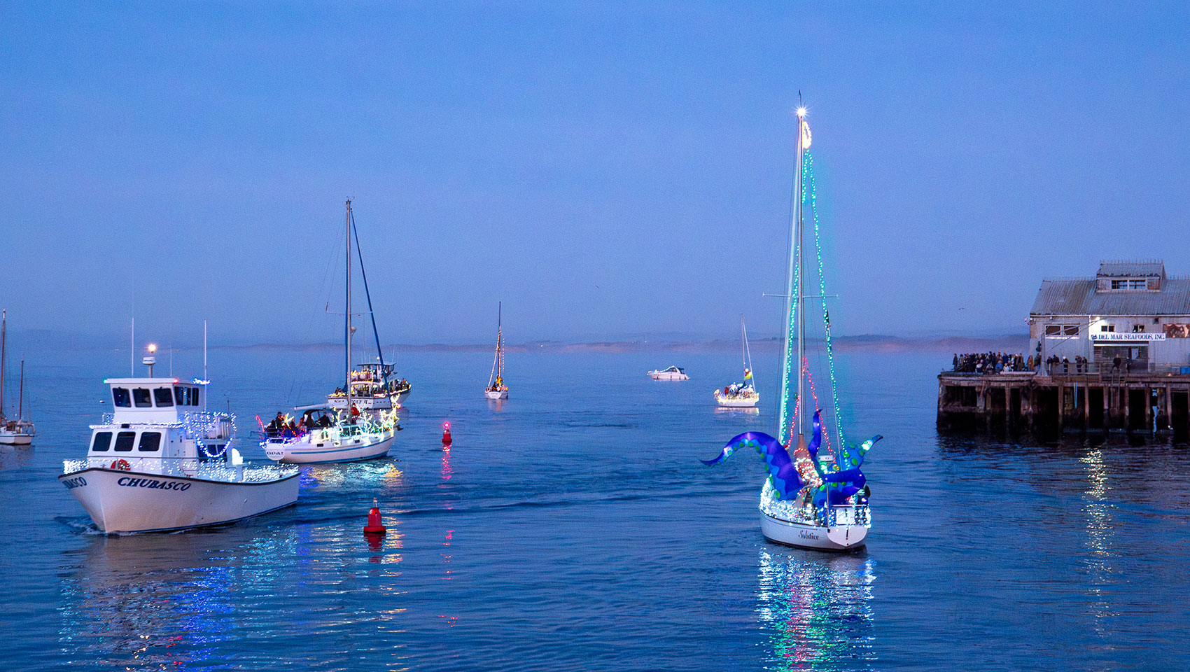 boats in the ocean near the marina