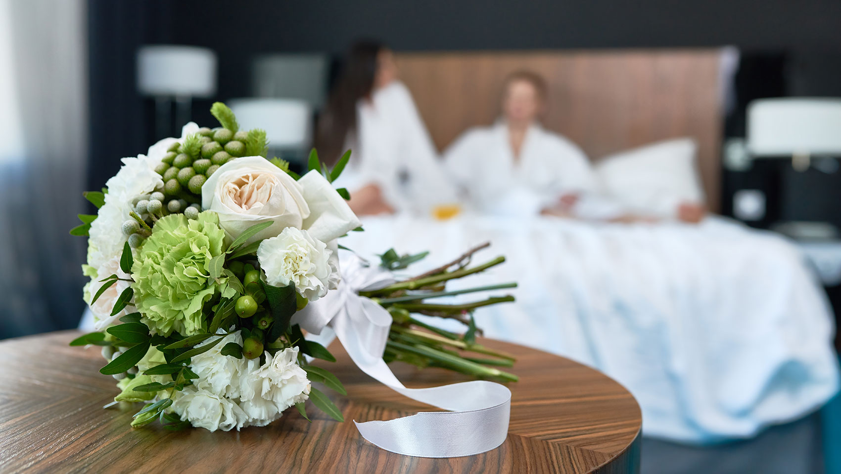 wedding bouquet on table in hotel guestroom