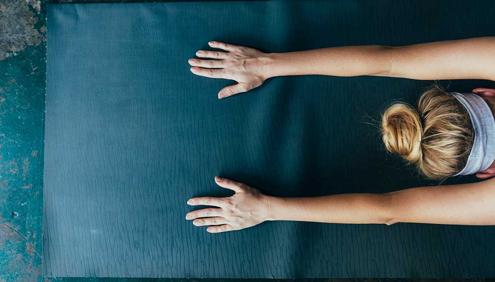 woman on yoga mat